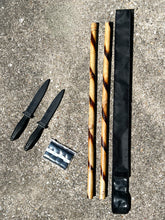 Load image into Gallery viewer, Overhead view of the Kali Starter Kit bundle: rattan sticks, rubber training knives, grip tape, and black nylon carrying case